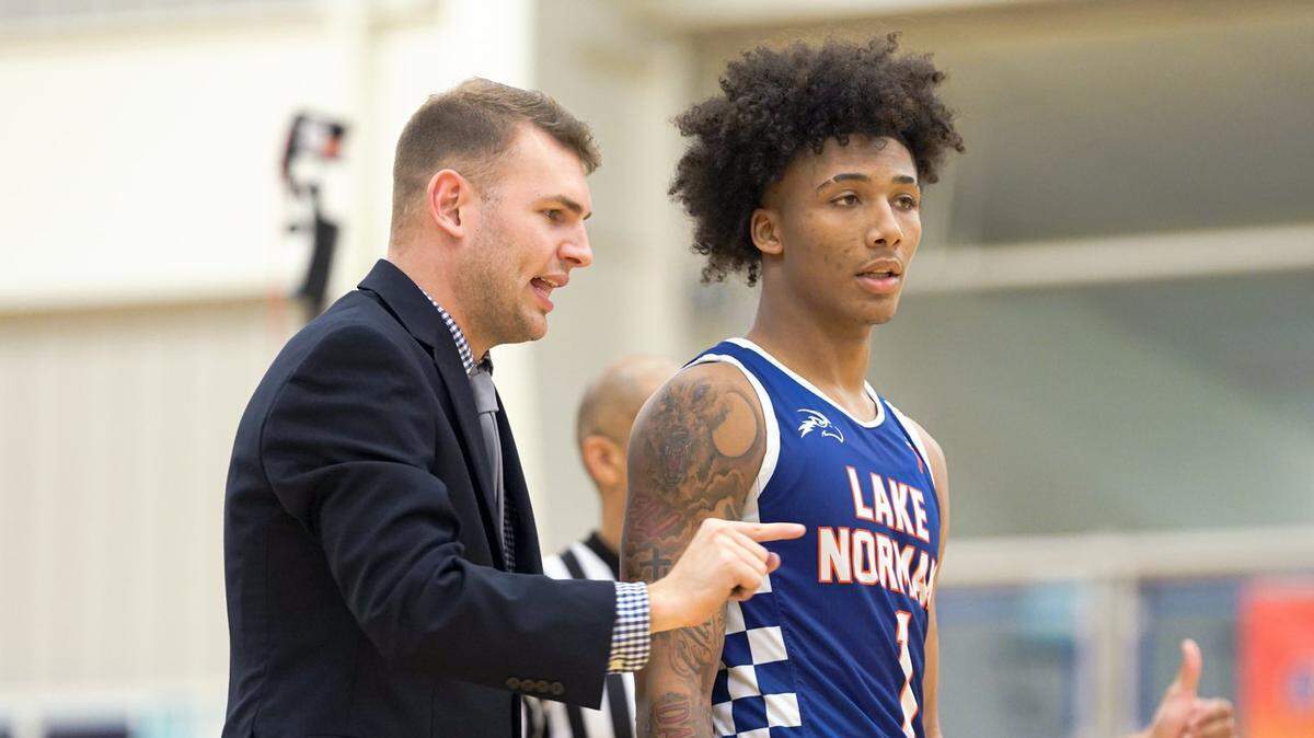 Lake Norman Christian coach Mason Padgett gives instructions to sophomore guard Mikey Williams