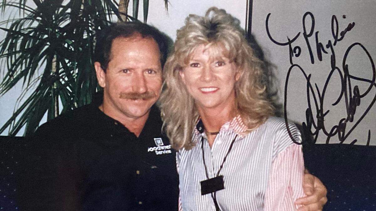 Phylis Lipford, right, with Dale Earnhardt.