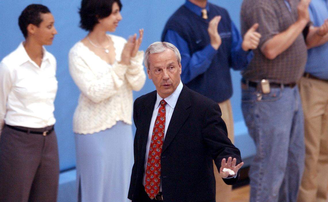 New UNC basketball coach Roy Williams waves to well-wishers as he enters a a press conference announcing his hiring in the practice gym in the Smith Center, Monday night, April 14, 2003.