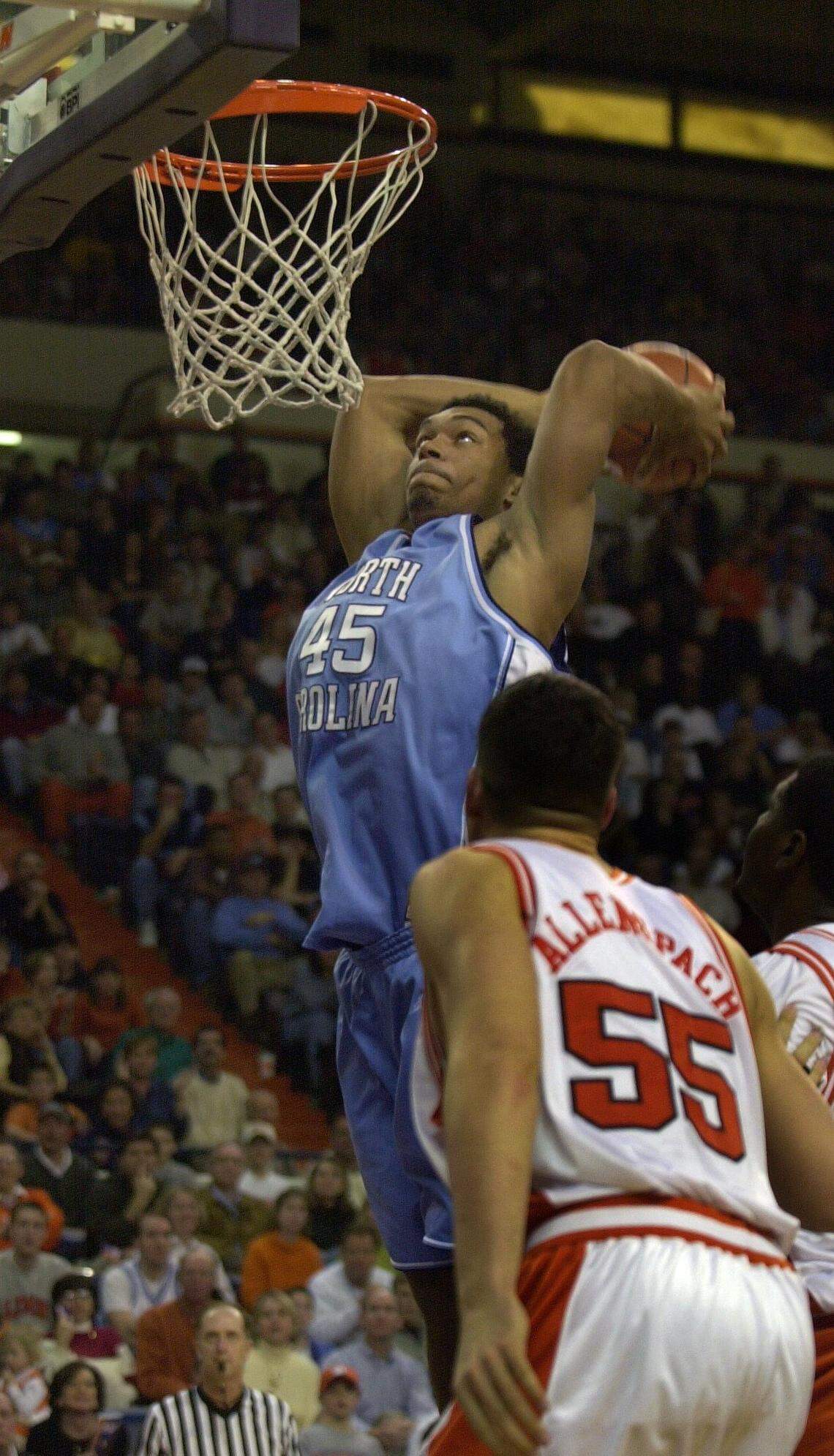 While playing basketball for UNC in 2001, Julius Peppers goes up for a dunk over Clemson’s Adam Allenspach. Peppers once said that playing in the FInal Four was a bigger deal than playing in the Super Bowl; he now rates the two experiences as even.
