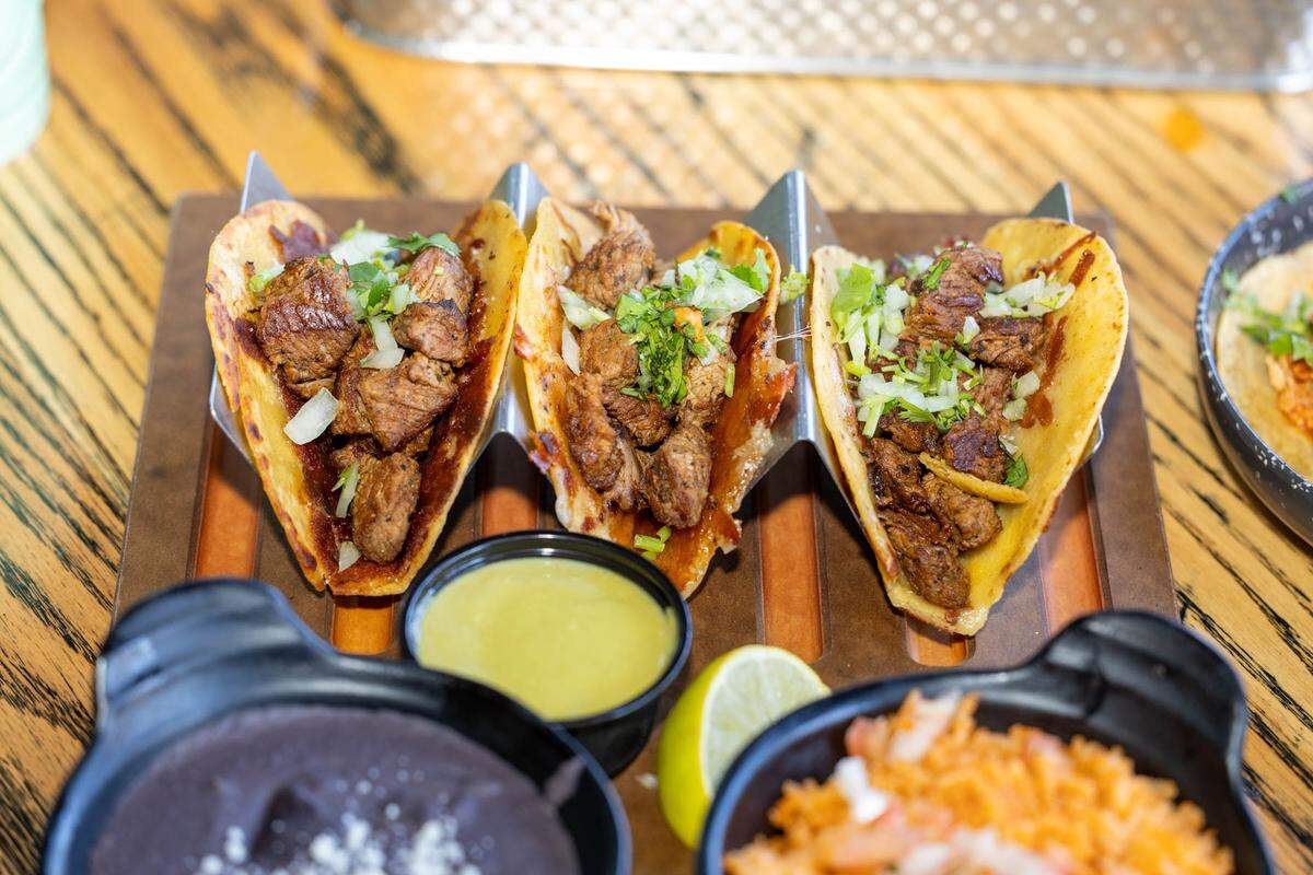 The Tijuana Steak Tacos at Que Onda have crispy cheese, onion and cilantro.