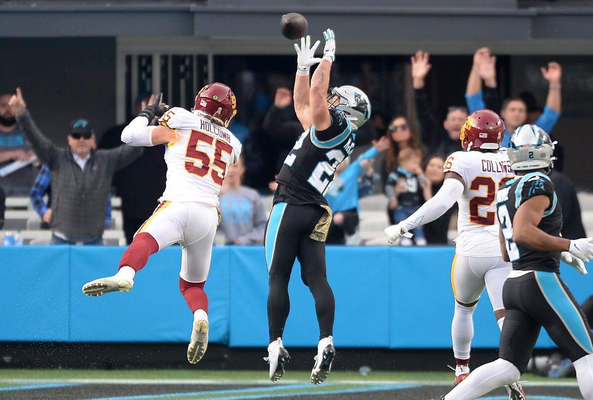 Carolina Panthers running back Christian McCaffrey catches a touchdown pass from quarterback Cam Newton during fourth quarter action at Bank of America Stadium in Charlotte, NC on Sunday, November 21, 2021. Washington defeated the Panthers 27-21.