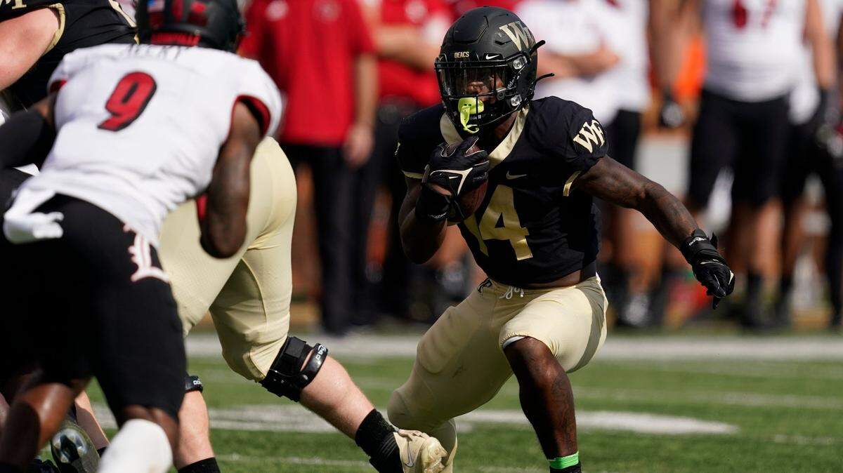 Wake Forest running back Justice Ellison runs against Louisville during the second half of an NCAA college football game on Saturday, Oct. 2, 2021, in Winston-Salem, N.C. (AP Photo/Chris Carlson)