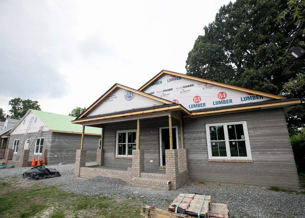 Work continues on the two 3D printed Habitat for Humanity home in Newport News Friday June 16, 2023.