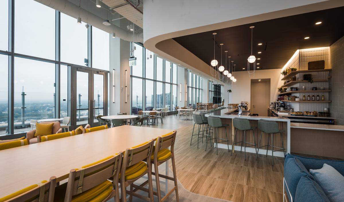 Honeywell’s 23-story headquarters in uptown has a fitness center, free parking and this cafe space on the top floor.