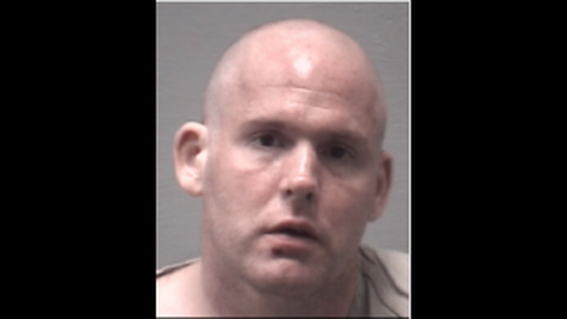 Eric Ryan Gurtler, 33, suffered minor injuries and faces charges of panhandling and simple assault. New Hanover County Jail photo.