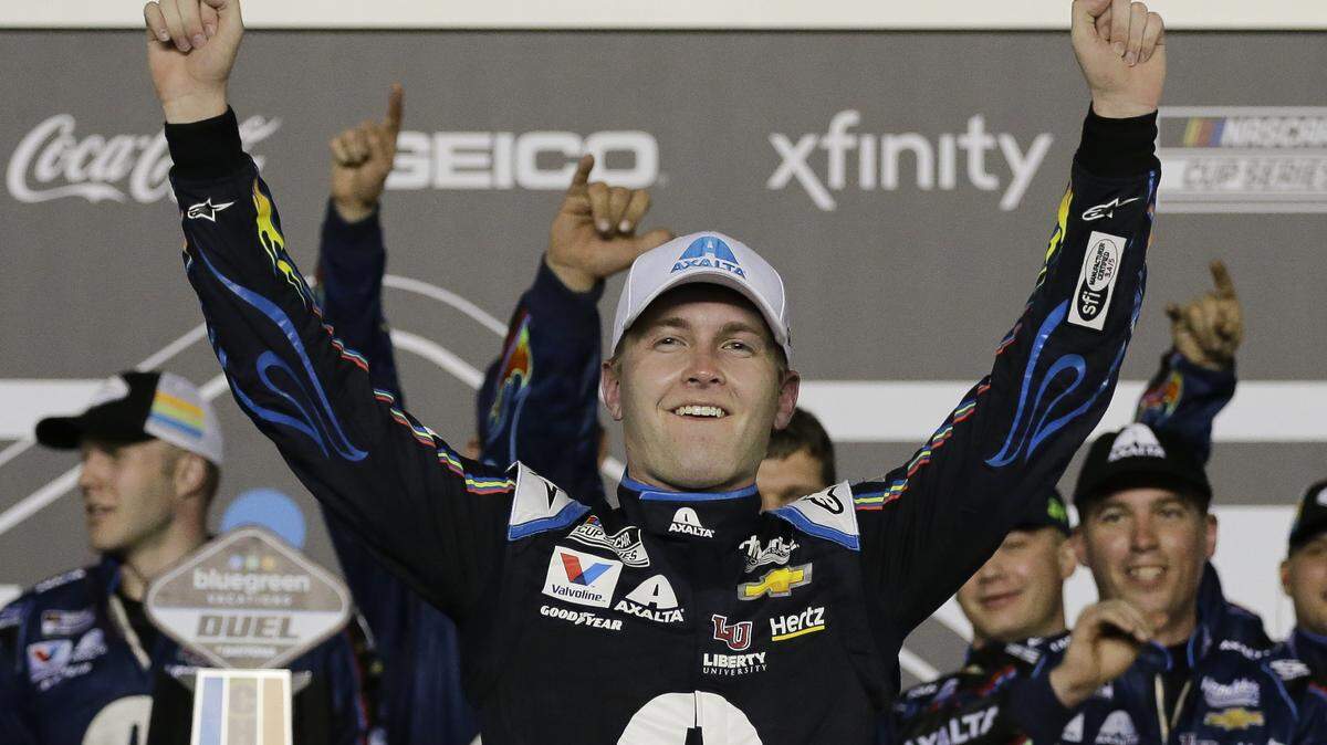 FILE - In this Feb. 13, 2020, file photo, William Byron celebrates after winning the second of the two NASCAR Daytona 500 qualifying auto races at Daytona International Speedway in Daytona Beach, Fla. Byron won his second consecutive NASCAR virtual race Sunday, April 19, 2020, by holding off Timmy Hill — the driver who moved him out of the way to win an earlier iRacing event — in a race finally low on dramatics. (AP Photo/Terry Renna, File)