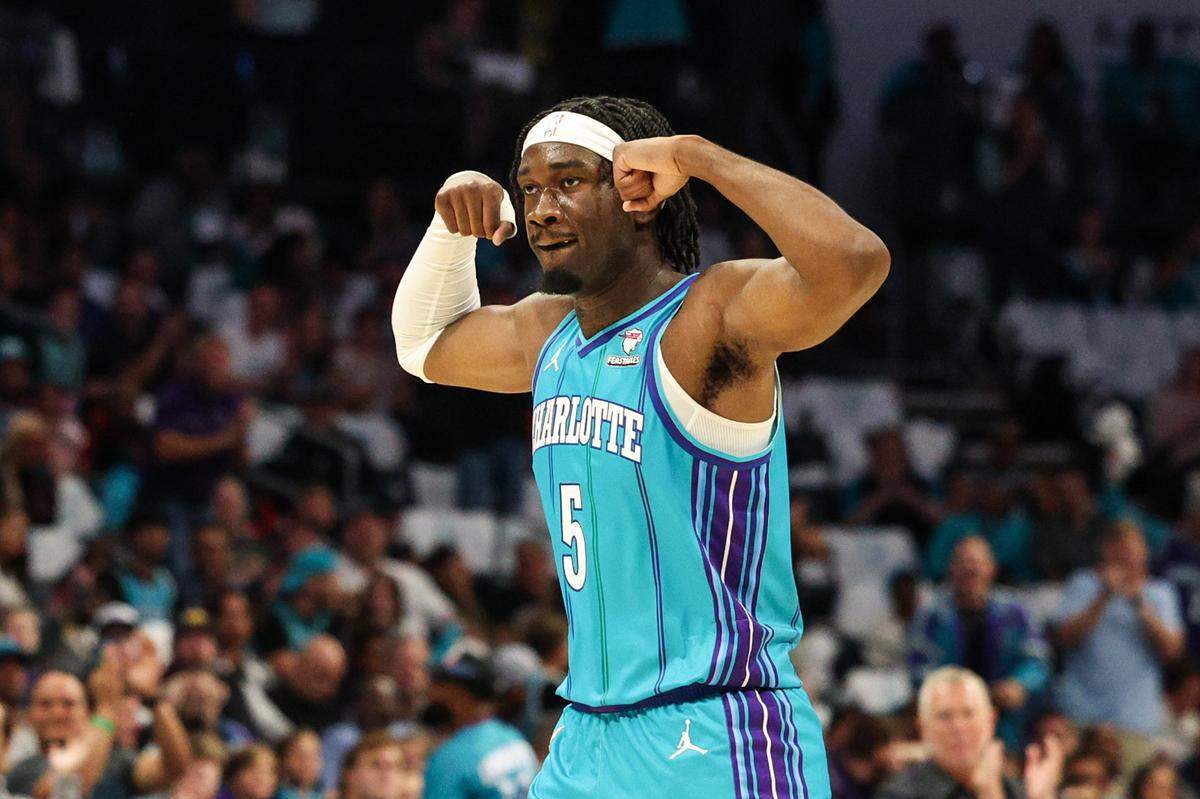 Hornets center Mark Williams raises his arms in celebration in 2023. Williams has played well lately, but in his Charlotte career he missed 60% of the games due to injury.