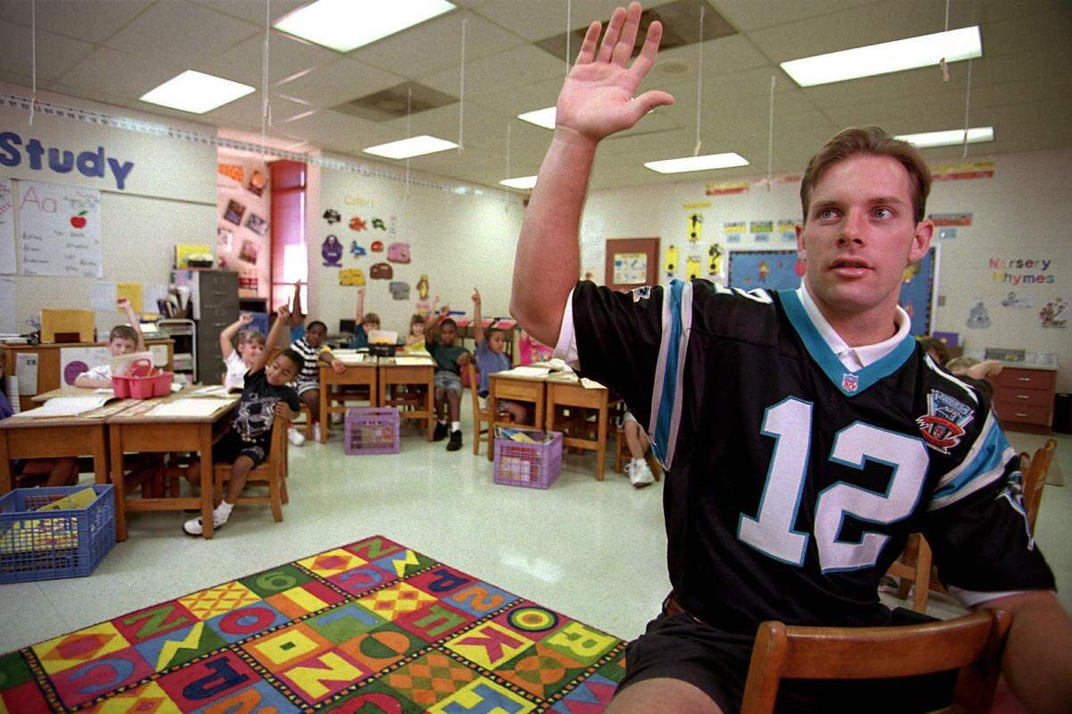 In 1995, Carolina Panthers rookie quarterback Kerry Collins posed for The Charlotte Observer in the middle of a first-grade class in Rock Hill, S.C.