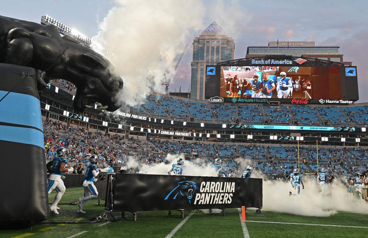 The Carolina Panthers run onto the field at Bank of America Stadium prior to action against the Detroit Lions on Friday, August 25, 2023 at Bank of America Stadium in Charlotte, NC.