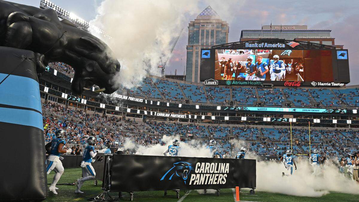 The Carolina Panthers run onto the field at Bank of America Stadium prior to action against the Detroit Lions on Friday, August 25, 2023 at Bank of America Stadium in Charlotte, NC.