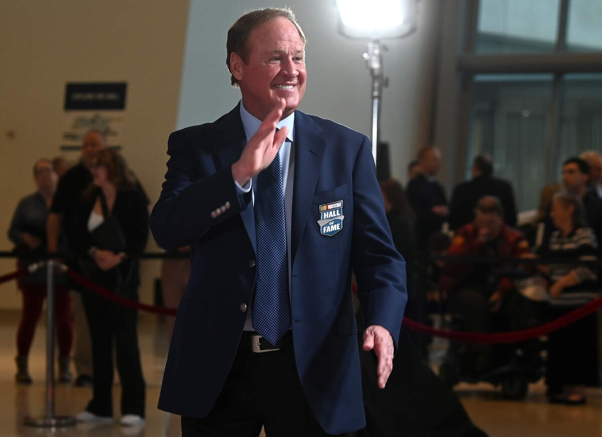 NASCAR Hall of Fame member Rusty Wallace waves to fans as he walks along the red carpet at the NASCAR Hall of Fame in Charlotte, North Carolina, on Jan. 19, 2024.