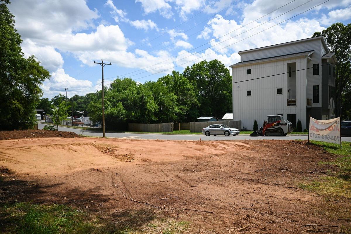 A leveled lot where a house previously stood on Allen Street in the Belmont neighborhood just outside uptown. House sizes have been steadily increasing across Mecklenburg County over the past decade, raising concerns by some over gentrification. 