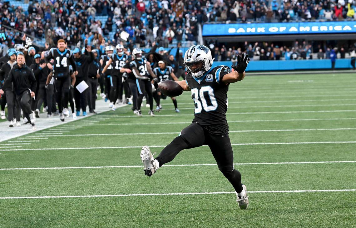 Carolina Panthers running back Chuba Hubbard high-steps into the end zone for the winning touchdown against the Arizona Cardinals at Bank of America Stadium in Charlotte, NC on Sunday, December 22, 2024. The Panthers defeated the Cardinals in overtime 36-30.
