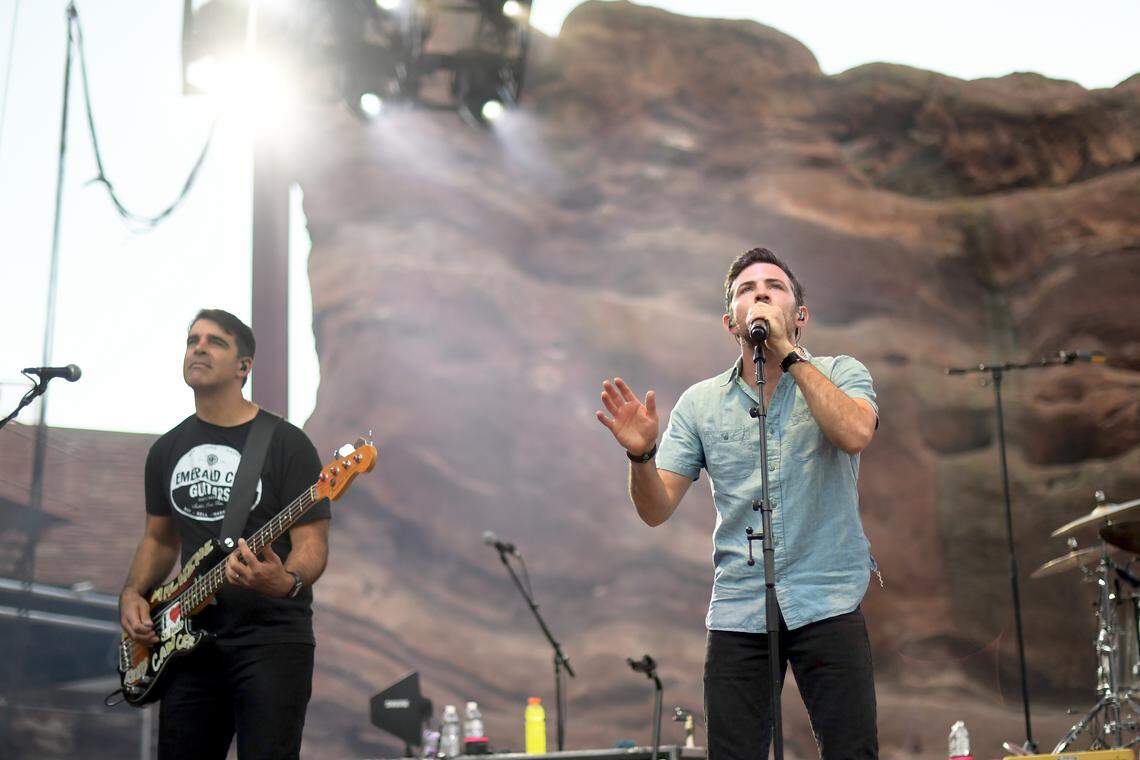 Bob Crawford, left, and Scott Avett of The Avett Brothers perform at Red Rocks Amphitheatre in 2018 in Colorado. Crawford worked on his book for a year between 2024 and 2025 while touring with the band, but always put away the work when it was time for sound checks ahead of their concerts..