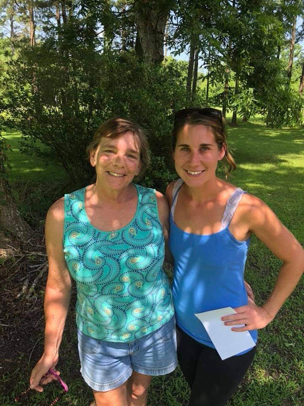 Donnie Johnson, sister of Denise, poses with reporter Delia D’Ambra.