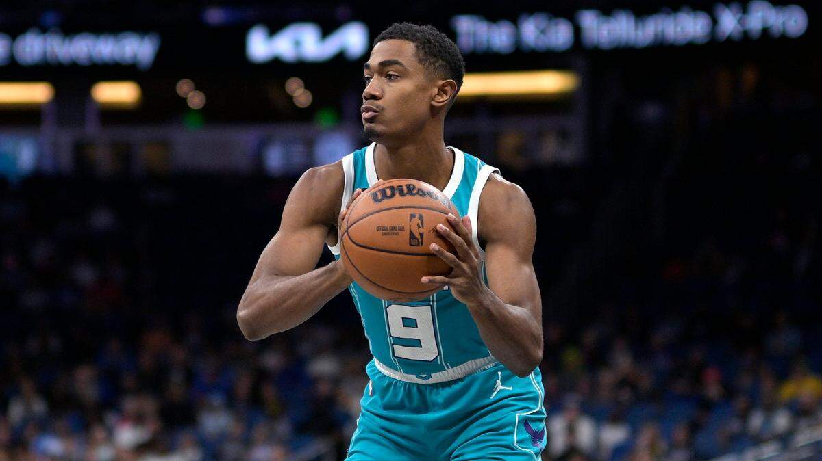 Charlotte Hornets guard Theo Maledon (9) looks to pass the ball during the first half of an NBA basketball game against the Orlando Magic, Monday, Nov. 14, 2022, in Orlando, Fla. (AP Photo/Phelan M. Ebenhack)