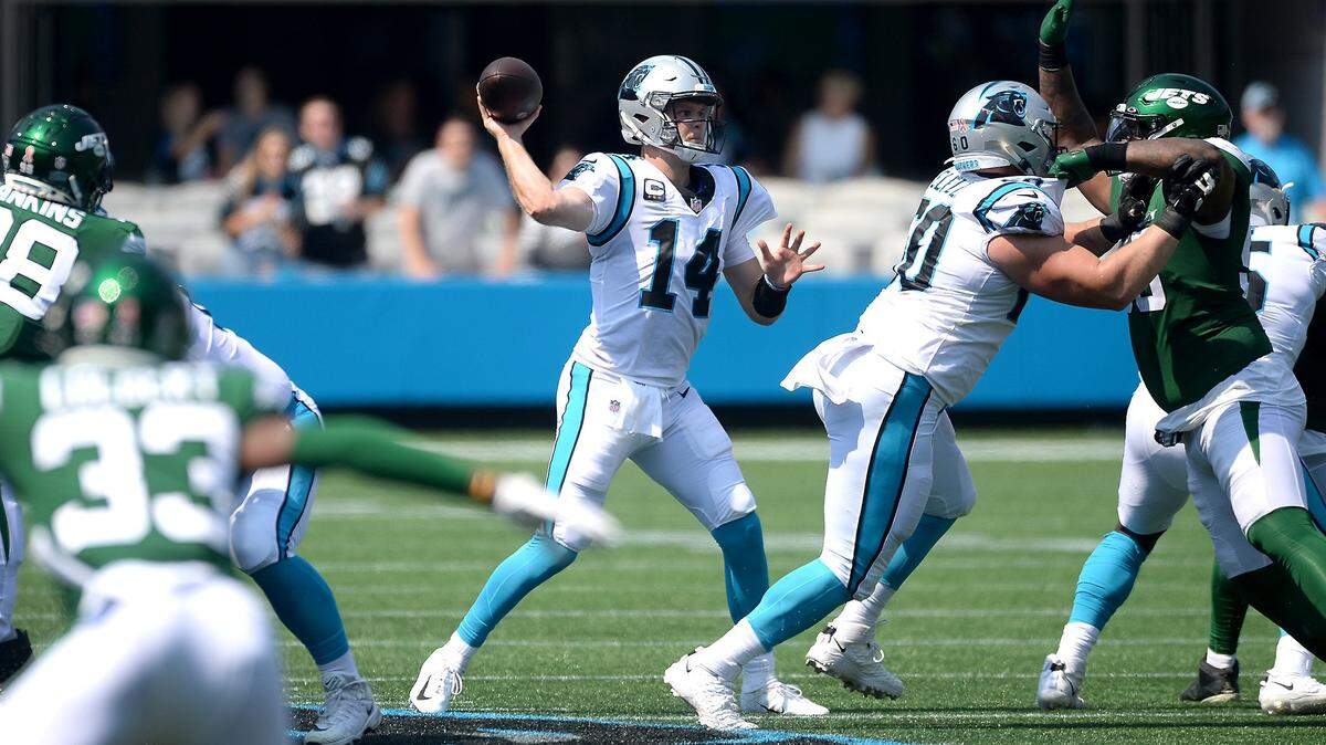 Carolina Panthers quarterback Sam Darnold, center, passes to a receiver during second quarter action against the New York Jets at Bank of America Stadium in Charlotte, NC on Sunday, September 12, 2021. The Panthers defeated the Jets 19-14.