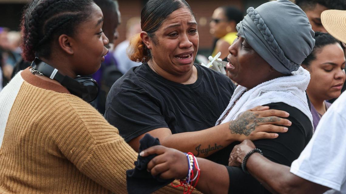 ‘Breathe ... heal.’ Community holds vigil with mother who lost 3 children in fire