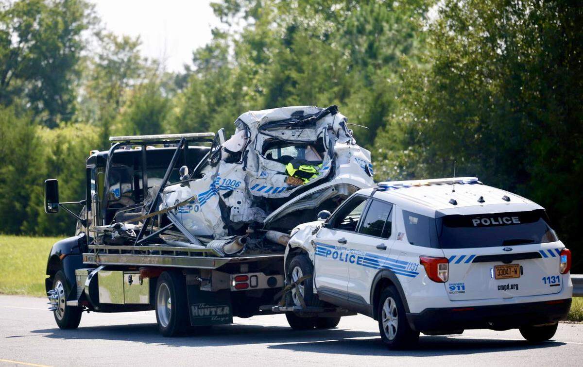 Two police vehicles are being towed away after the camper struck a vehicle and also crashed into two police vehicles on the shoulder of the Interstate 485 off ramp at Mt. Holly Road Thursday, Aug. 22, 2024.