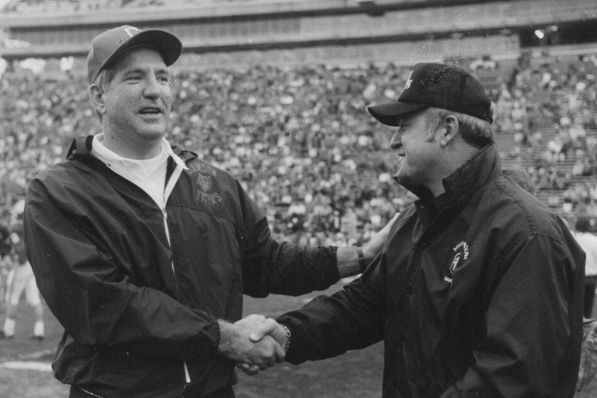 Clemson coach Danny Ford, left, visited with South Carolina coach Joe Morrison in the 1980s before the two teams squared off in their traditional rivalry game.