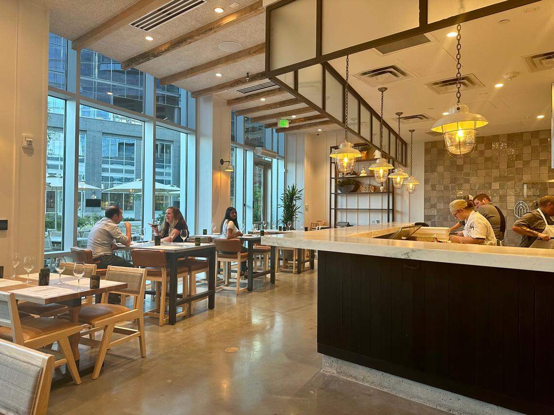 Floor to ceiling windows let in natural light at Sixty Vines.