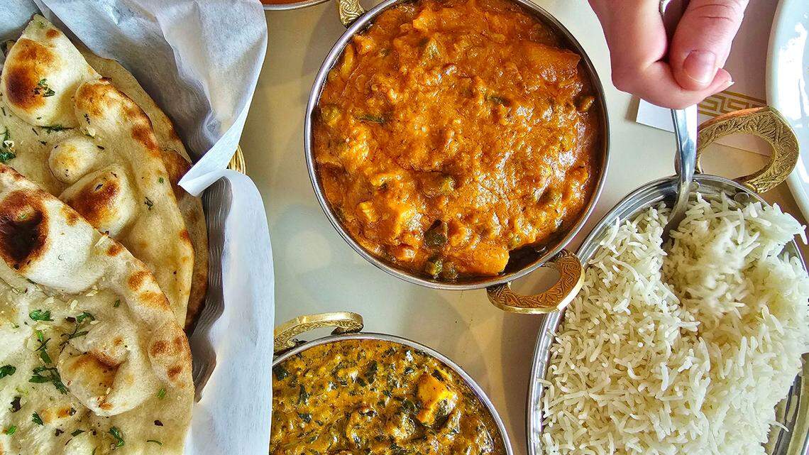 A meal from Curry Gate complete with garlic naan, vegetable curry, palak paneer and basmati rice.