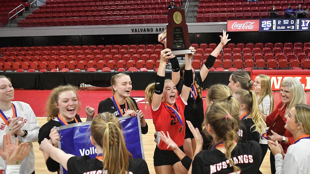 Middle Creek’s Graceyn Shepard (24) celebrates with the 4A Championship trophy and her team after their victory over Cox Mill. The Middle Creek Mustangs and the Cox Mill Chargers met in the NCHSAA 4A Volleyball Championships in Raleigh, N.C. on November 4, 2023.