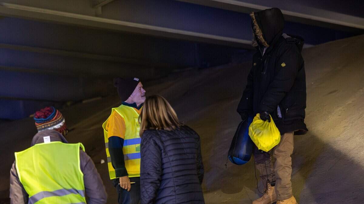 Moe Cieri, left, talks to an unhoused man after giving him some supplies during the 2026 Point-in-Time Count in Charlotte, N.C., on Thursday, January 22, 2026.

