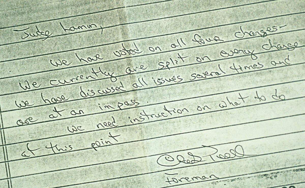 A copy of the note delivered to Judge Charles Lamm from the jury foreman in the Rae Carruth capital murder trial, saying the jury was at an “impass.” Lamm sent them back to try again. Jury foreman Clark Pennell said he would have spelled the word “impasse” correctly if he had known the note would become public.