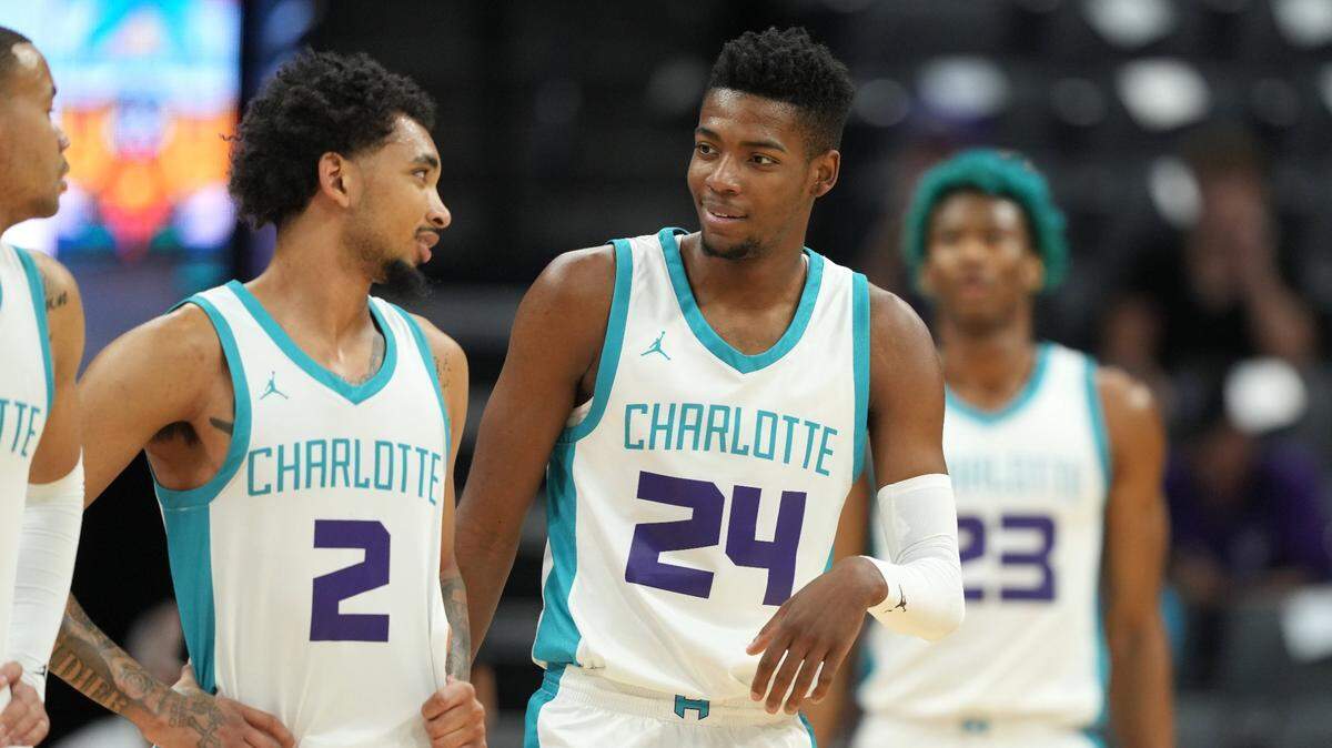 Charlotte Hornets guard James Bouknight (2) and forward Brandon Miller (24) talk during the first quarter against the Golden State Warriors at Golden 1 Center on Wednesday, July 5, 2023.