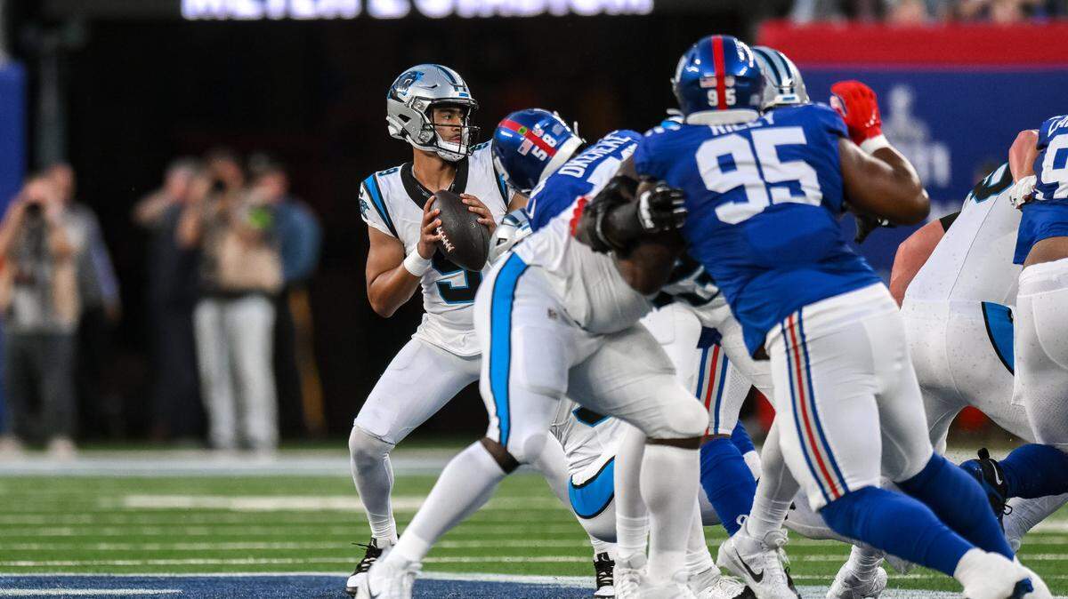 Carolina Panthers quarterback Bryce Young (9) looks to pass the ball as New York Giants linebacker Bobby Okereke (58) applies pressure during the first quarter at MetLife Stadium.