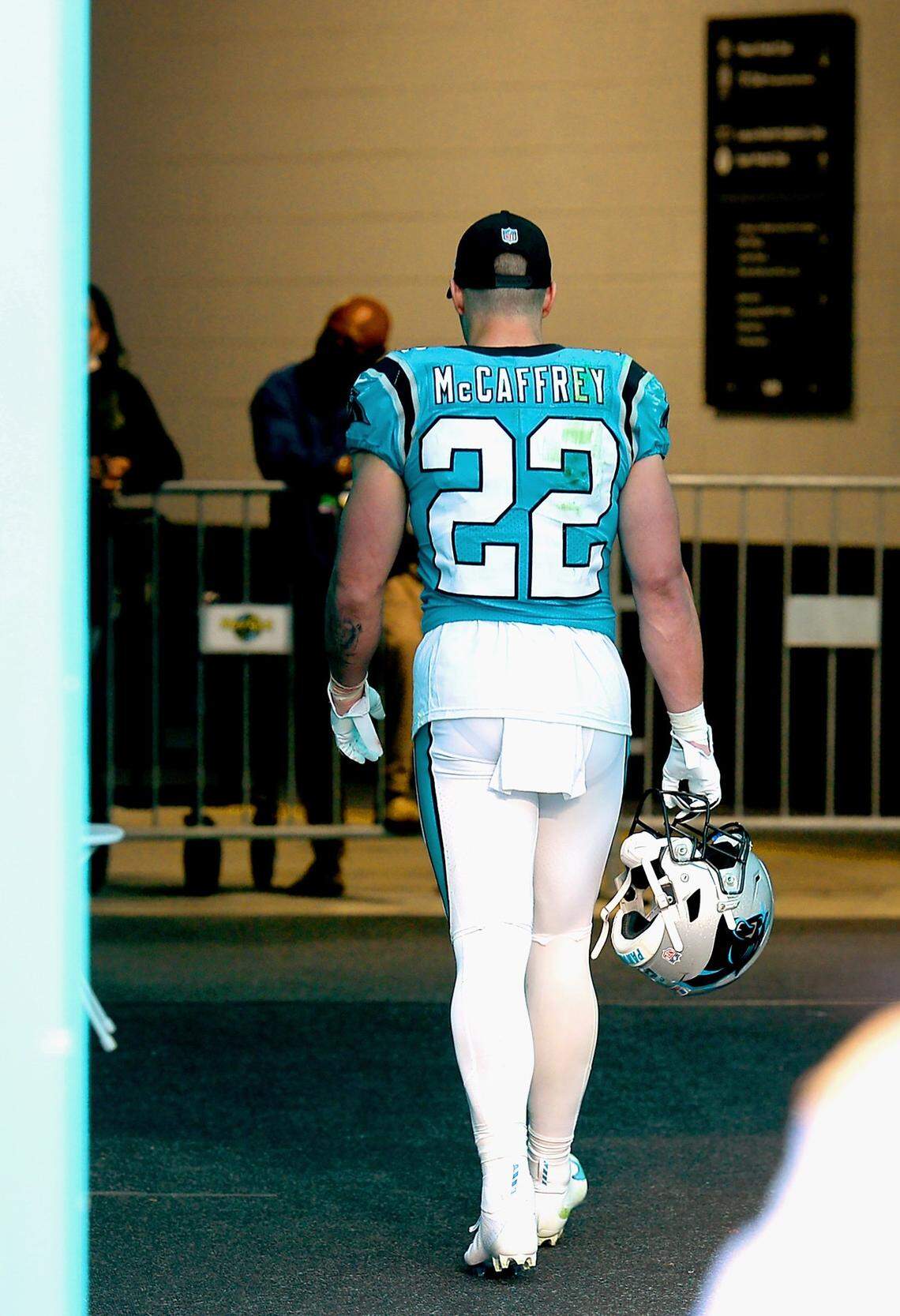 Carolina Panthers running back Christian McCaffrey walks to the team’s locker room following a 33-10 loss to the Miami Dolphins at Hard Rock Stadium in Miami Gardens, Fla. on Sunday, November 28, 2021. McCaffrey missed more than half the game after re-injuring his ankle.
