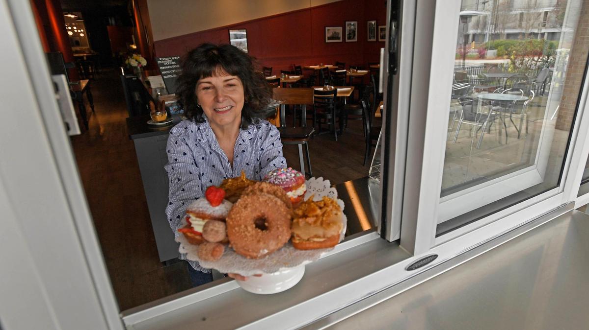 Fran Scibelli, shown holding a plate of doughnuts, closed Fat Cat Burgers + Bakeshop on Nov. 11 on Park Road.
