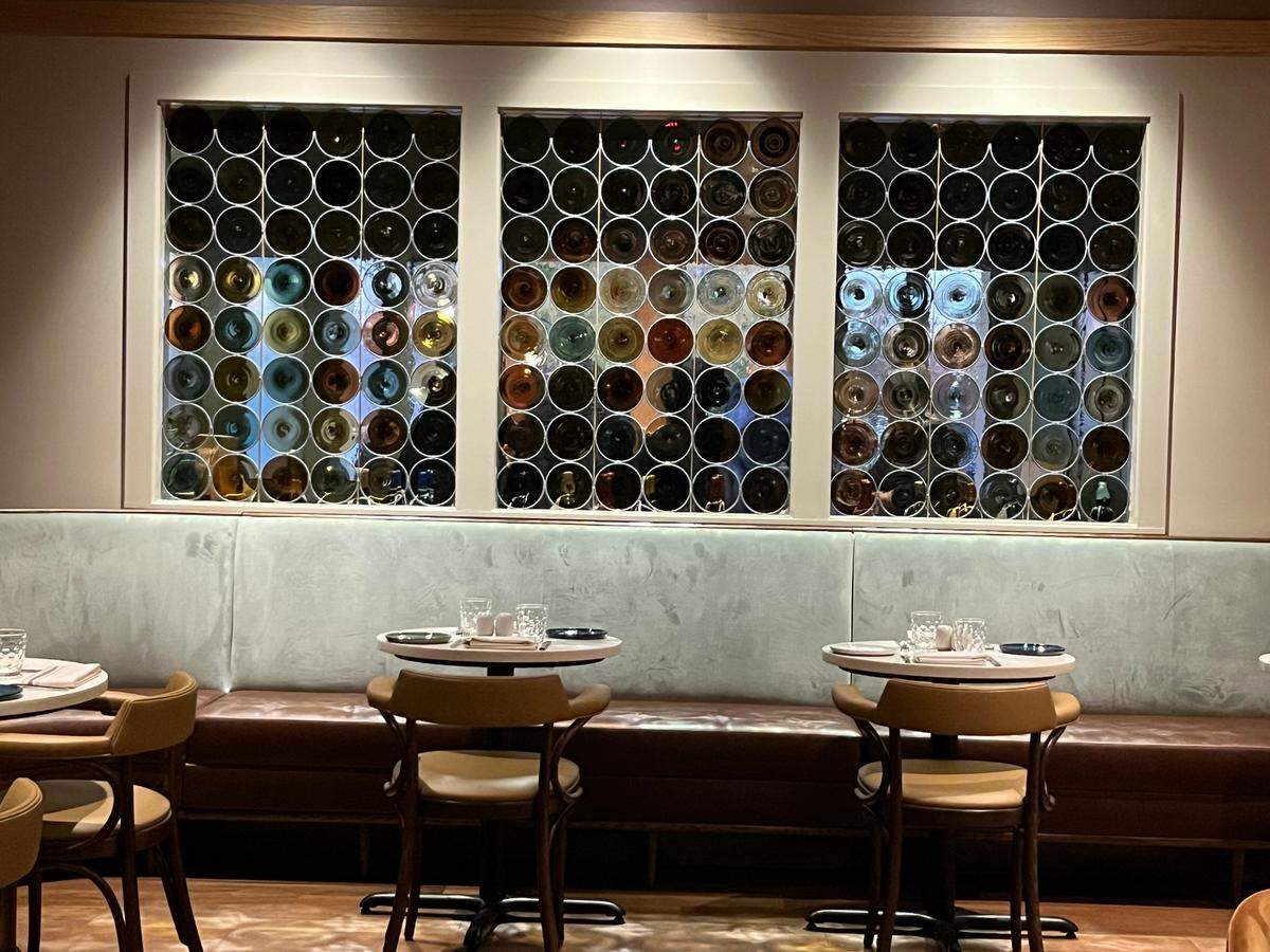 A stained glass feature decorates seating in the bar area.