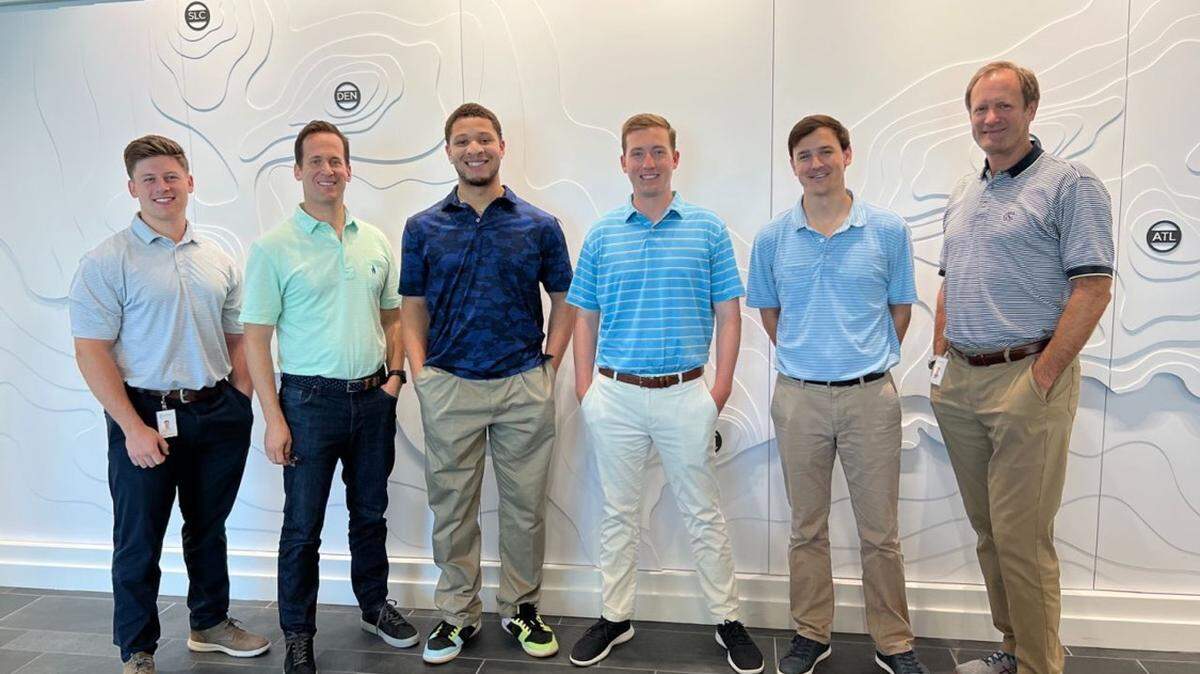 Isaac Allen, center in the dark blue shirt, was part of the Project Destined program last summer that had him spend several months working with Crescent Communities employees from left, Pete Sittema, Rick Voight, Ben Douglas, Jack Barnett and Alec Petty. Crescent is one of the larger development companies in Charlotte and was seeking to reach a more diverse candidate pool in the wake of George Floyd’s death in 2020.