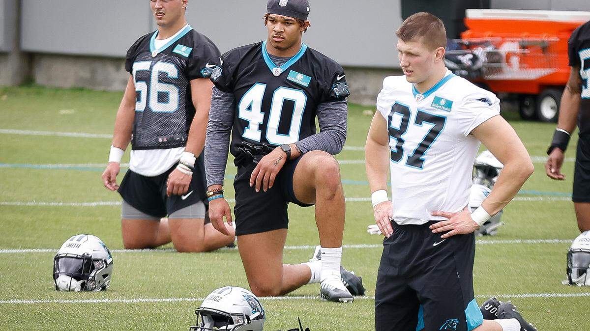 Carolina Panthers Teddy Gallagher (56) Brandon Smith (40) and Josh Babicz (87) on the field during rookie minicamp at the Panthers practice field in Charlotte, N.C., Friday, May 13, 2022.