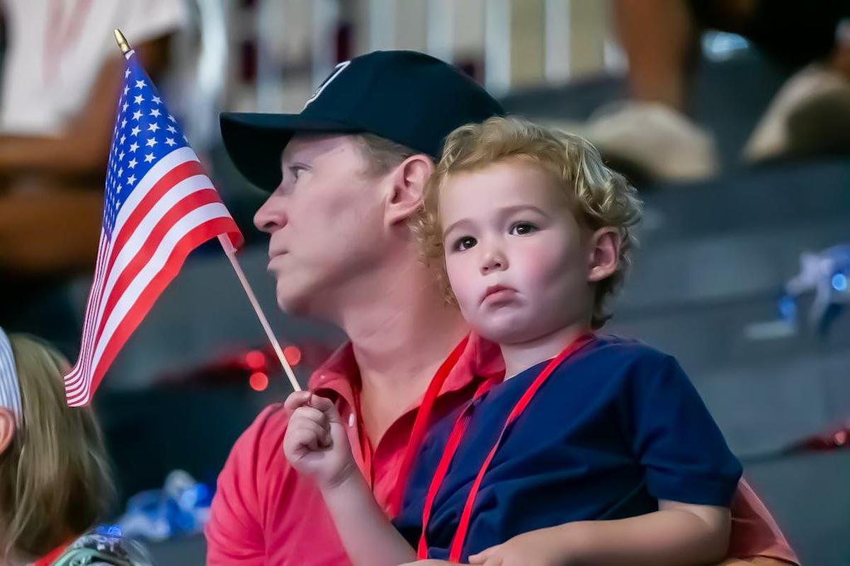 Fans waved their American flags to show support at the Providence Day Pep rally for the USA Field Hockey sendoff to the Olympics in Paris