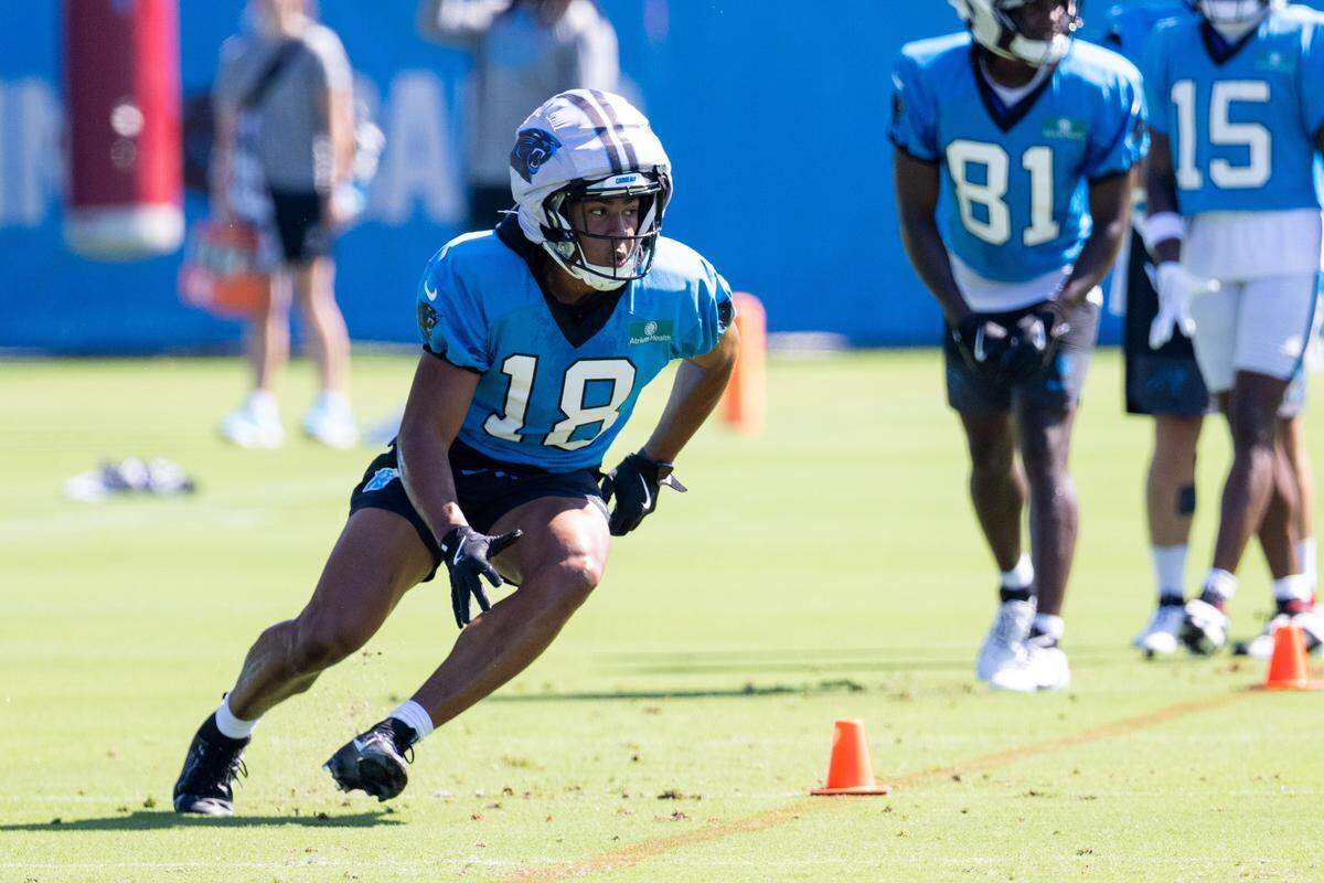 Carolina Panthers wide receiver Jalen Coker (18) runs routes during training camp.