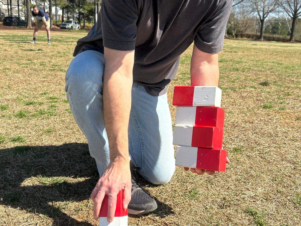 Mike Horengic displays Kubb set pieces. 