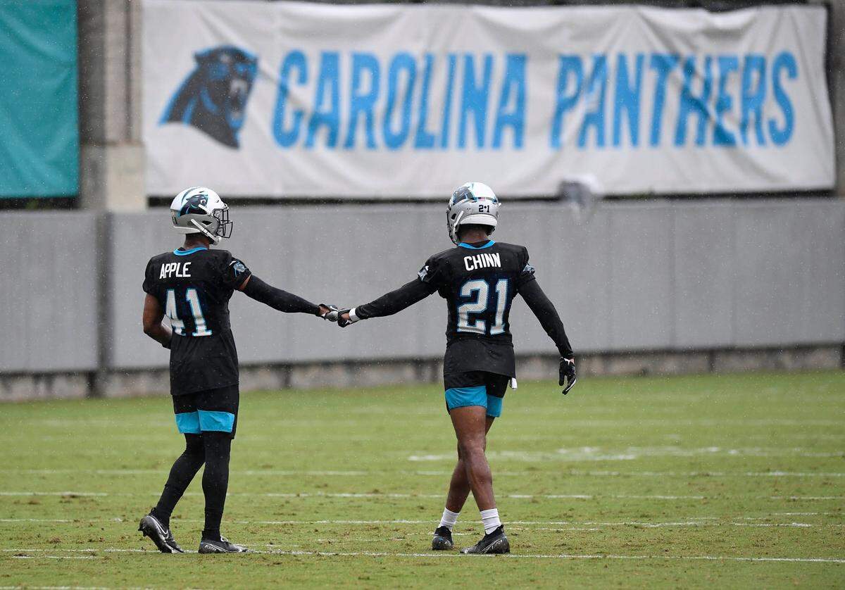 Carolina Panthers cornerback Eli Apple (41) and safety Jeremy Chinn (21) tap fists during practice in training camp at the team’s practice facility on Friday, August 21, 2020.