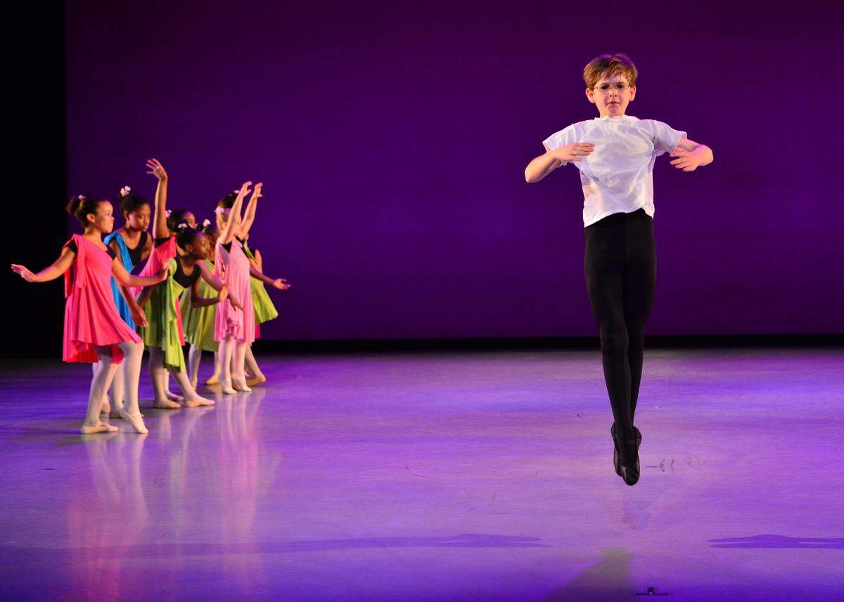 A young Alex Griffith performs a solo in an end-of-year Reach performance.  Alex, now 16, graduated from Reach in 2014 but scholarships have enabled him to continue taking classes at Charlotte Ballet. Next season he’ll be a pre-professional trainee.
