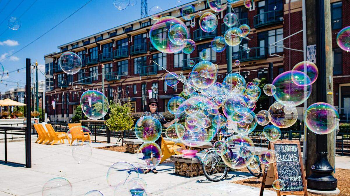 Catch the Soap Bubble Circus, as well as floral, musical and art installations on the Rail Trail during South End Blooms.