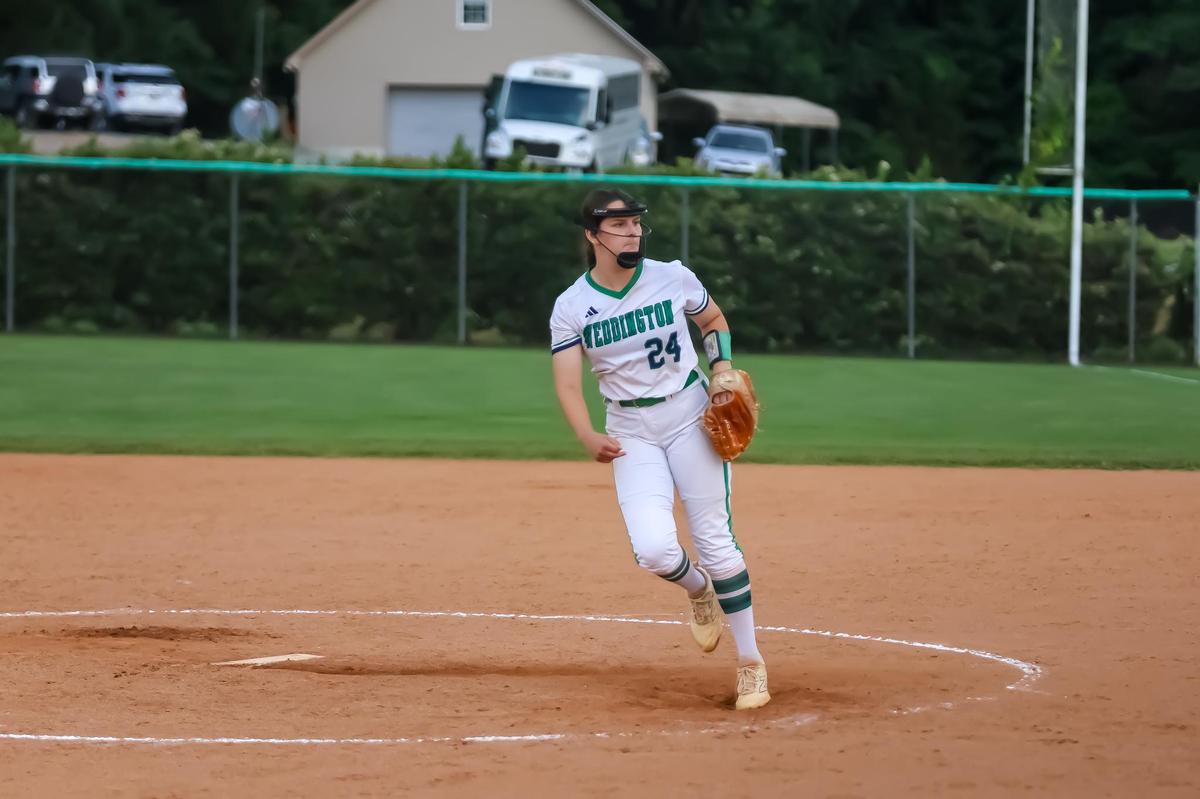 Weddington‘s Joella Thomas winds up to pitch at Game 1 of the NCHAA regional championship series in May 20th, 2025 at Weddington high school in Weddington, NC