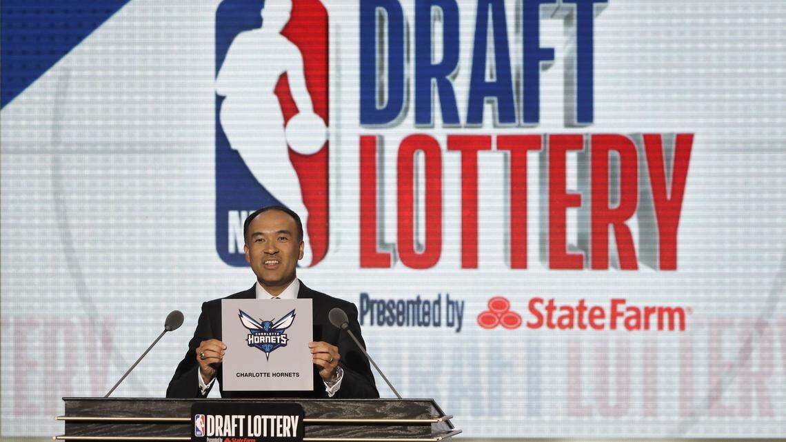NBA Deputy Commissioner Mark Tatum announces that the Charlotte Hornets would remain at the 11th pick in the draft during the NBA basketball draft lottery Tuesday in Chicago.