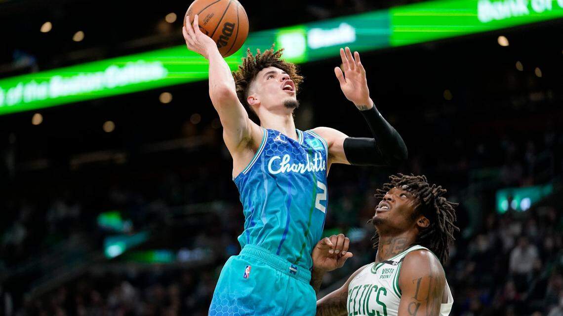 Charlotte Hornets guard LaMelo Ball (2) drives to the basket past Boston Celtics center Robert Williams III (44) during the second half of an NBA basketball game, Wednesday, Feb. 2, 2022, in Boston. (AP Photo/Steven Senne)