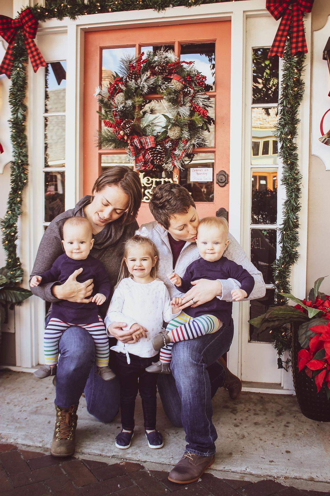 Megan and Alison Cruise, photographed with their three daughters.