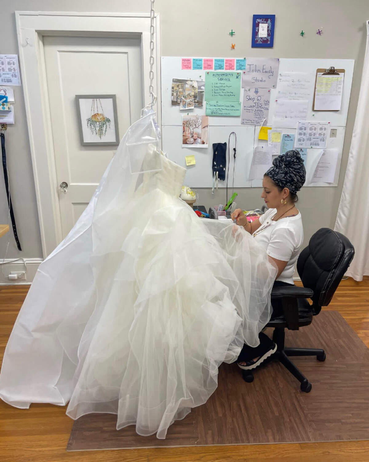 John Emily Studio co-founder Katheryn Hermida works on a bridal gown.
