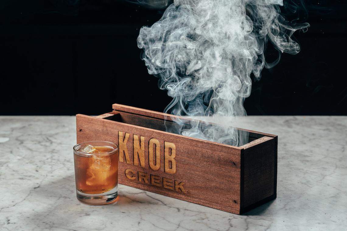 The Hot Box is Knob Creek Personal Selection bourbon, Islay Scotch, sweet vermouth, Hellfire Bitters and pecan smoke, served over ice.