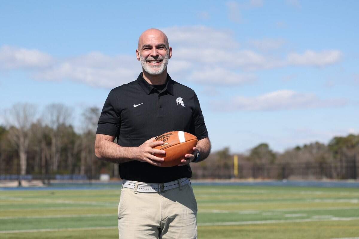 Kenneth McClamrock is the new football coach at Community School of Davdison in Huntersville, NC. McClamrock posed for a portrait on the school's football field on Monday, February 23, 2026.